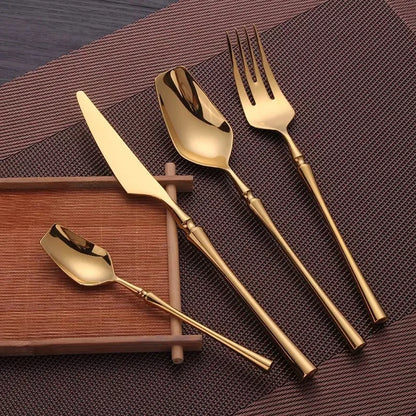 Stainless Steel Cutlery Set with Gold Accents and Polished Finish