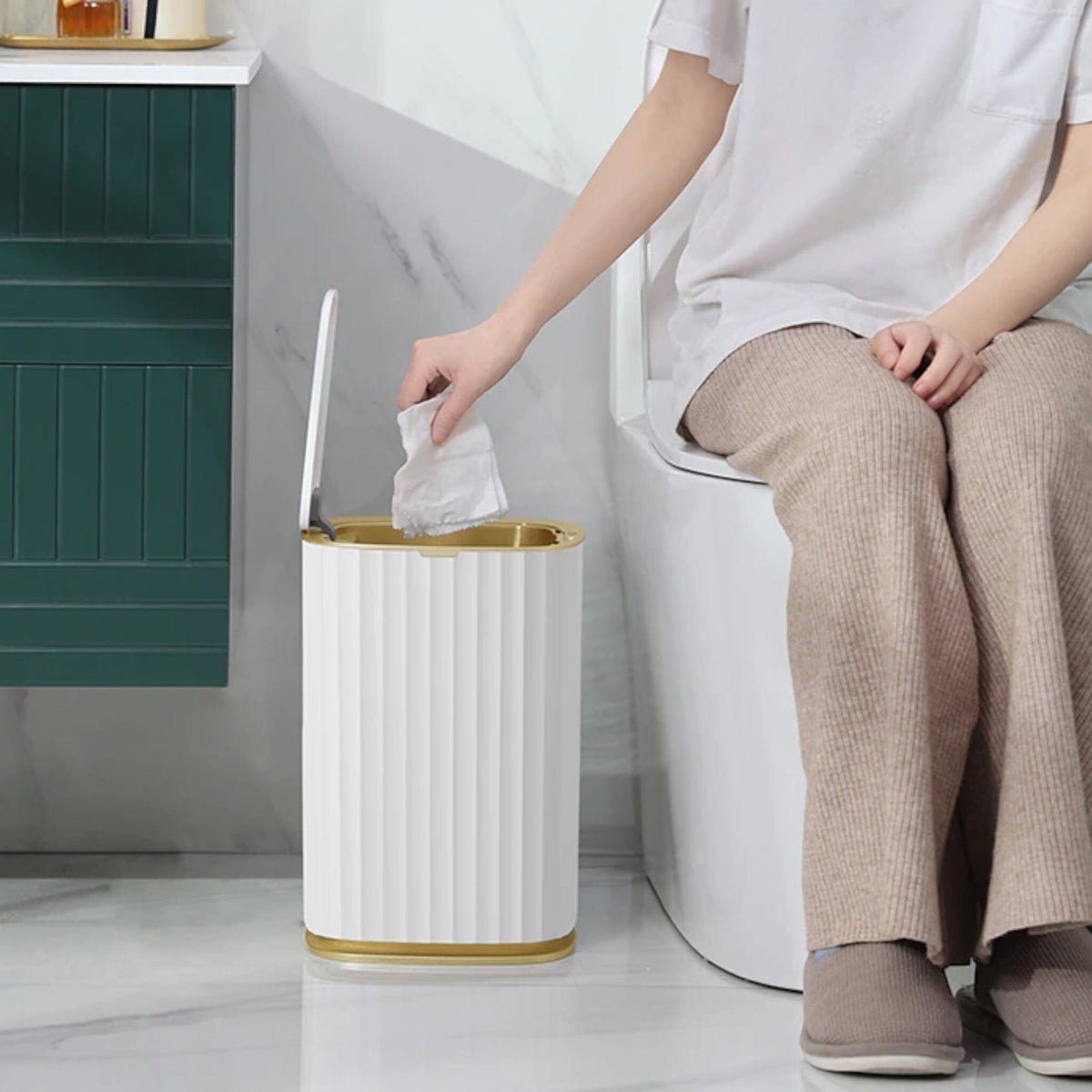 White Ribbed Bathroom Bin with Gold Trim and Push Lid