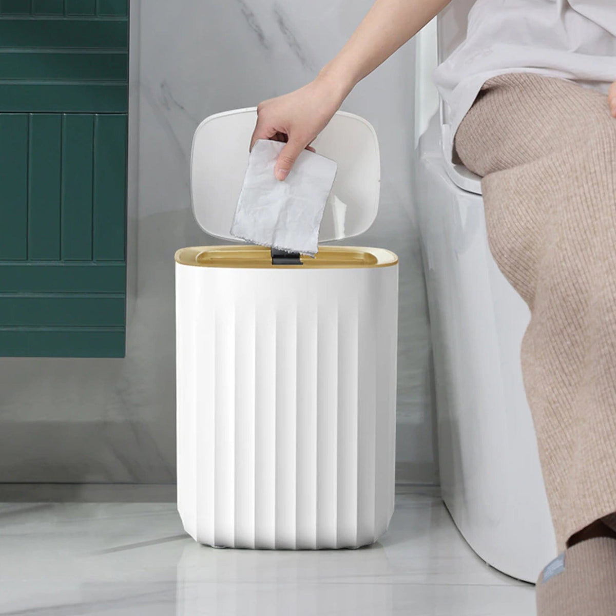 White Ribbed Bathroom Bin with Gold Trim and Push Lid